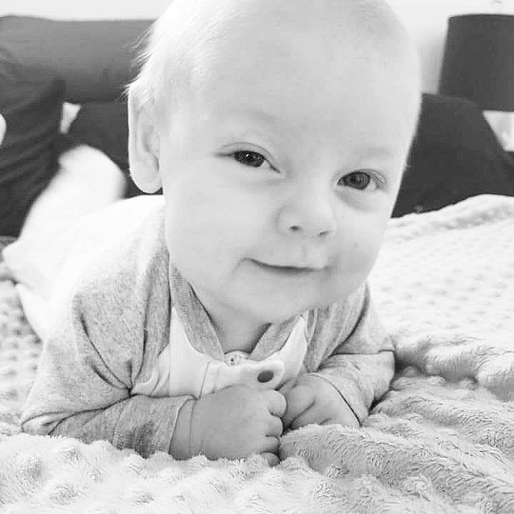 Brighton is registered to the contest to win money with this photo: black_and_white, cheek, child, ear, emotion, eye, face, head, infant, monochrome, monochrome_photography, nose, person, photograph, photography, portrait, portrait_photography, skin, smile, toddler