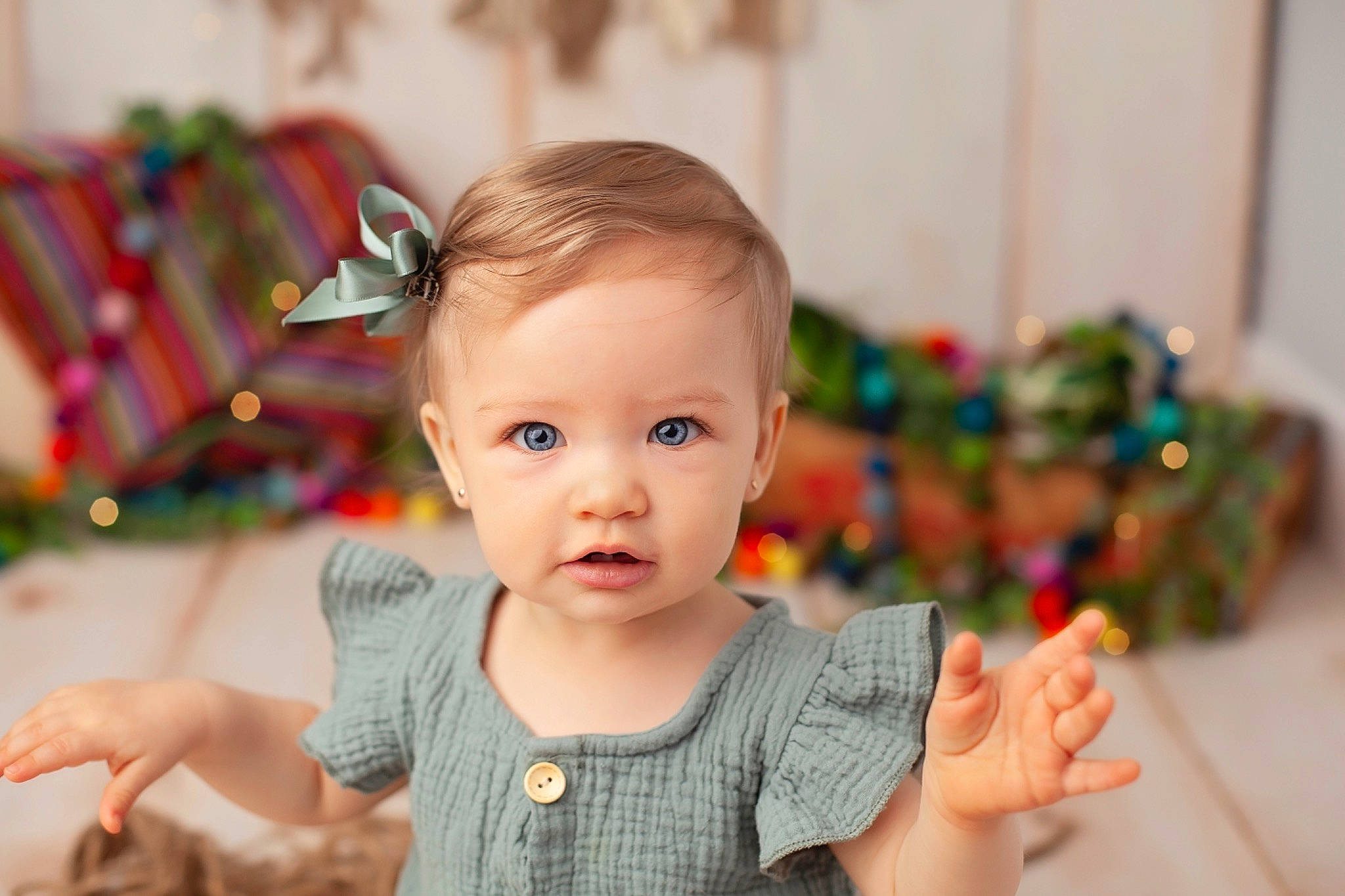 Briele is registered to the contest to win money with this photo: baby, cheek, child, christmas, ear, holiday, person, play, room, skin, toddler, tree