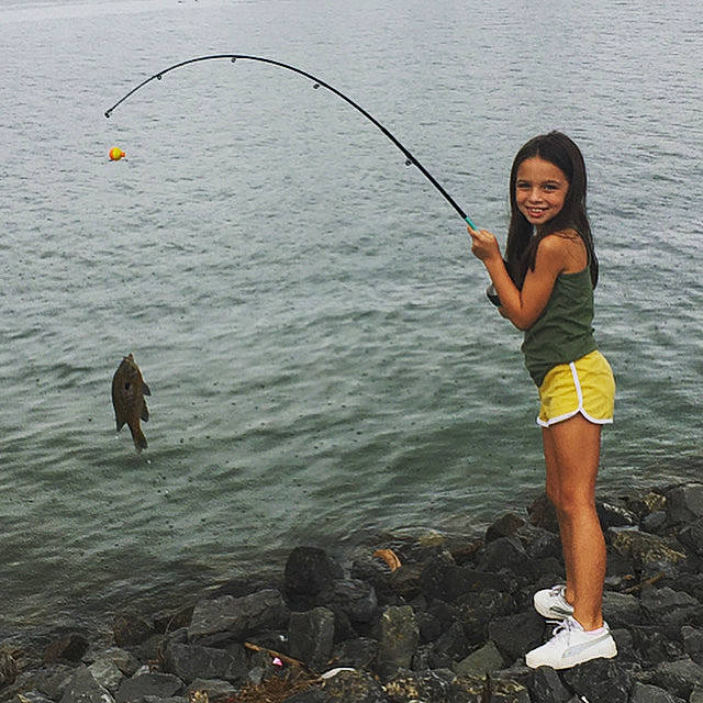 Prisha is registered to the contest to win money with this photo: angling, body_of_water, casting_fishing, fisherman, fishing, fishing_reel, fishing_rod, fly_fishing, fun, jigging, joy, lake, leisure, outdoor_recreation, person, recreation, recreational_fishing, smile, surf_fishing, toddler