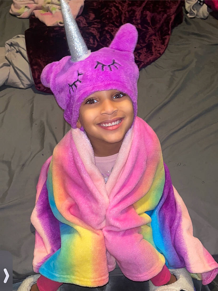 Asyia joined the competition — help win amazing prizes! beanie, cap, child, costume, costume_hat, electric_blue, event, fashion_accessory, fun, happy, headwear, hood, hoodie, joy, laugh, magenta, person, pink, purple, smile
