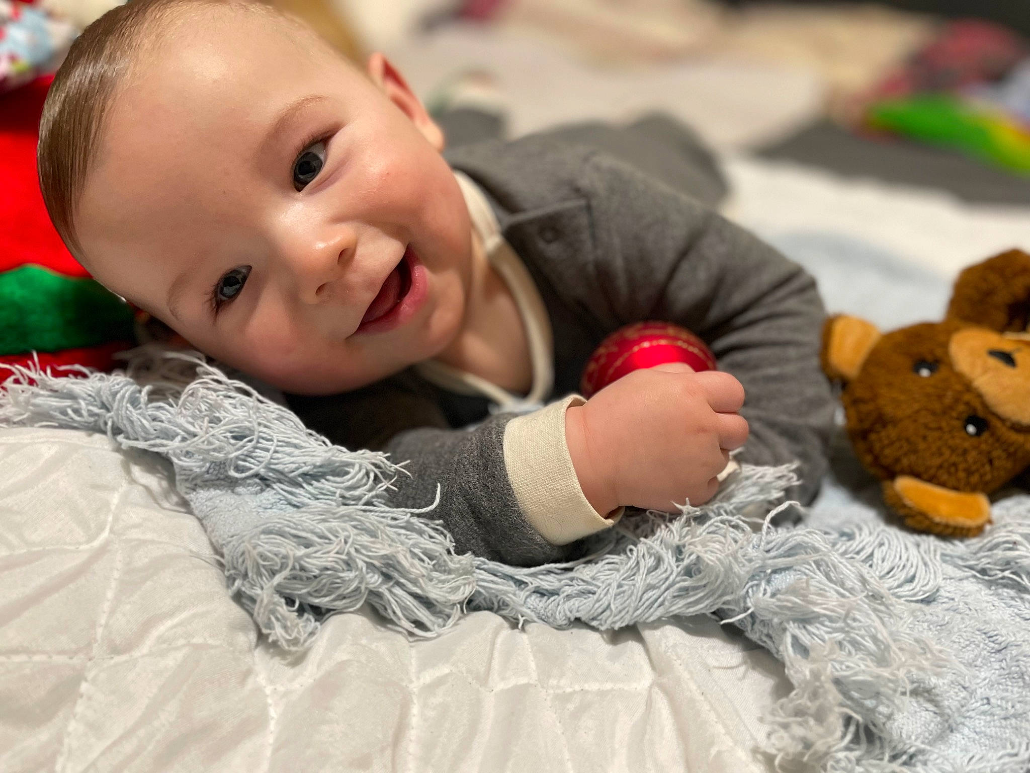 Cyrus is registered to the contest to win money with this photo: baby, child, event, eye, fun, fur, grass, happy, leisure, mammal, person, portrait_photography, room, sitting, skin, smile, textile, toddler, toy, vertebrate