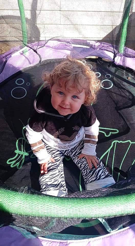 Kielynn is registered to the contest to win money with this photo: auto_part, automotive_exterior, automotive_tire, beauty, cool, fun, grass, green, happy, joy, leisure, mammal, motor_vehicle, person, pink, product, purple, recreation, smile, toddler