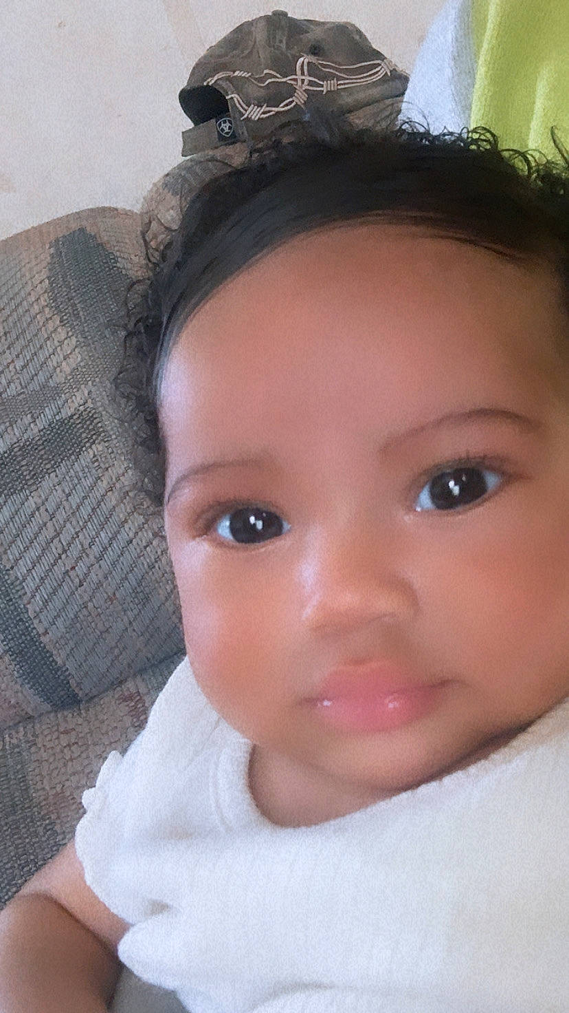 Leena is registered to the contest to win money with this photo: baby, baby_toddler_clothing, black_hair, cheek, chin, ear, eyebrow, eyelash, flash_photography, forehead, hair, happy, headgear, iris, lip, neck, no_expression, nose, person, skin