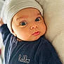 Jed a rejoint le concours — aidez-le/la à gagner de superbes lots ! baby, infant, face, beanie, clothing, onesie, blue_eyes, expression, cute, portrait, soft_texture, laying_down, closeup, child, newborn, headwear, fabric, person, indoors, casual