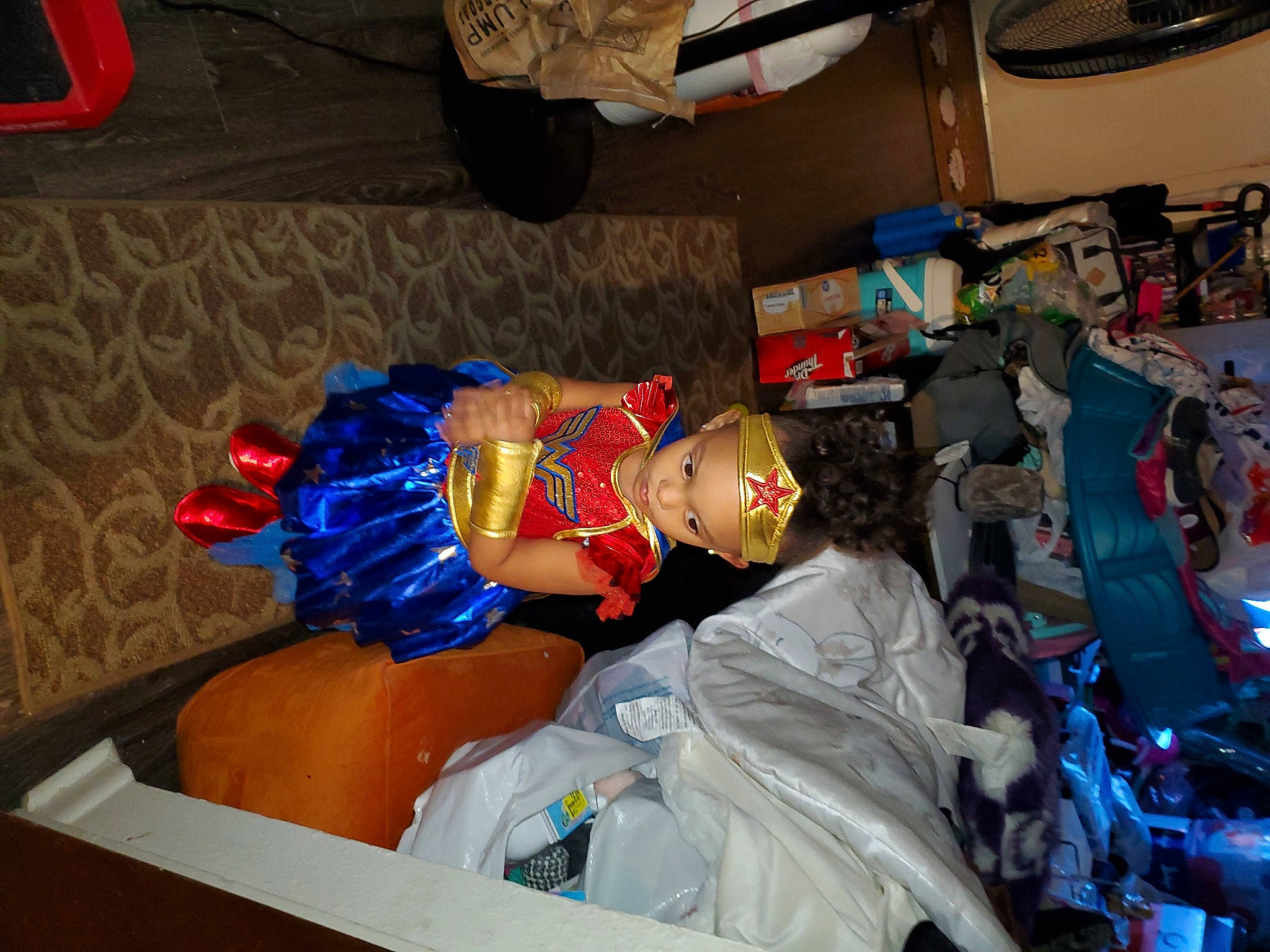 Harmony is registered to the contest to win money with this photo: child, costume, electric_blue, event, fictional_character, fun, hat, machine, person, plastic, room, toy, trunk