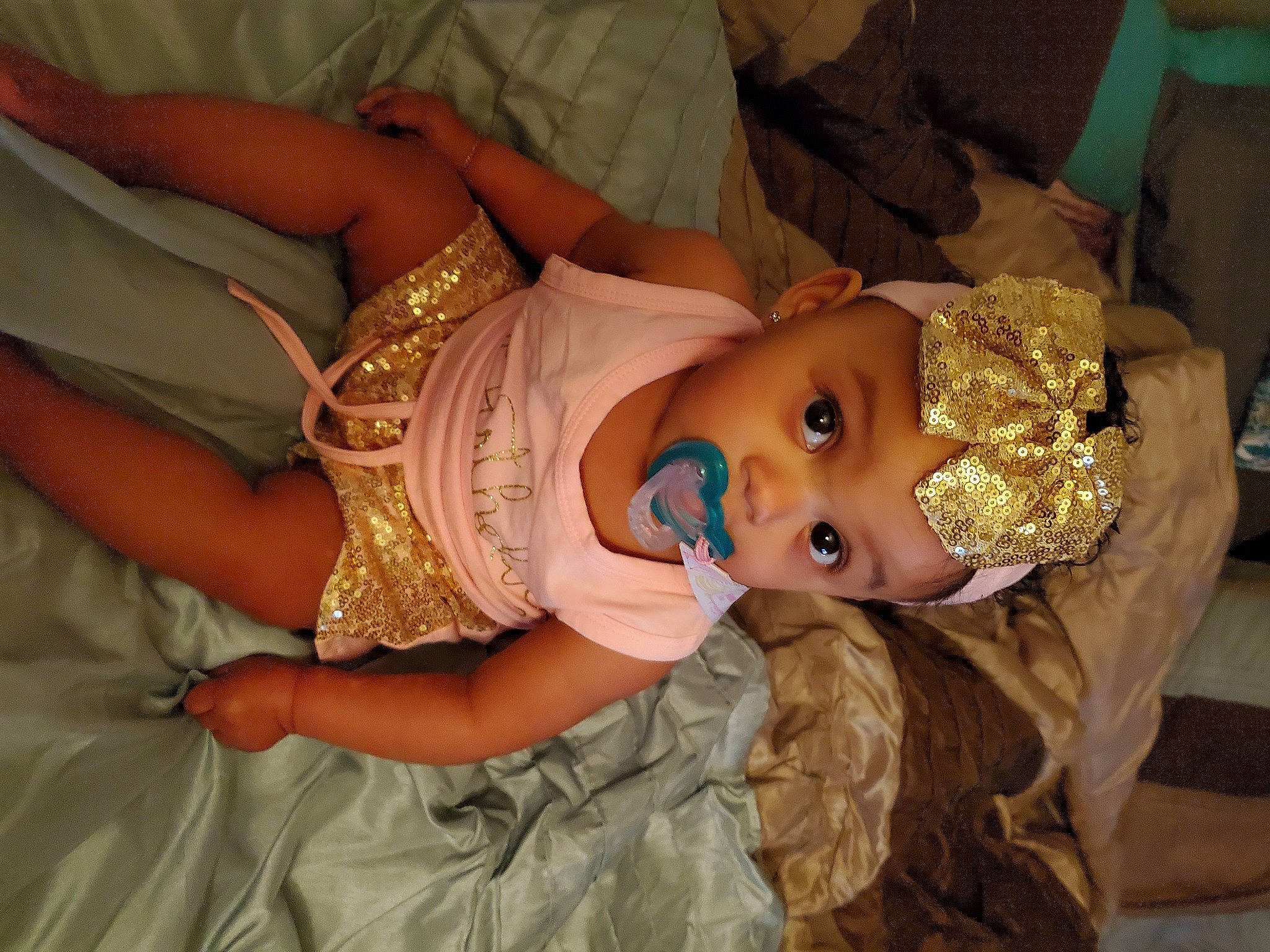 Harmony is registered to the contest to win money with this photo: abdomen, baby, baby_toddler_clothing, cheek, child, dress, event, eye, fun, happy, headgear, headwear, jewellery, pattern, person, skin, smile, textile, toddler, tradition