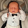 Mylan participe au concours pour gagner de l'argent avec cette photo : baby, sleeping, infant, tuxedo, bow_tie, white_clothing, blanket, plush, soft_texture, cute, peaceful, portrait, indoors, child, newborn, cozy, buttoned_shirt, small_hands, car_seat, fabric