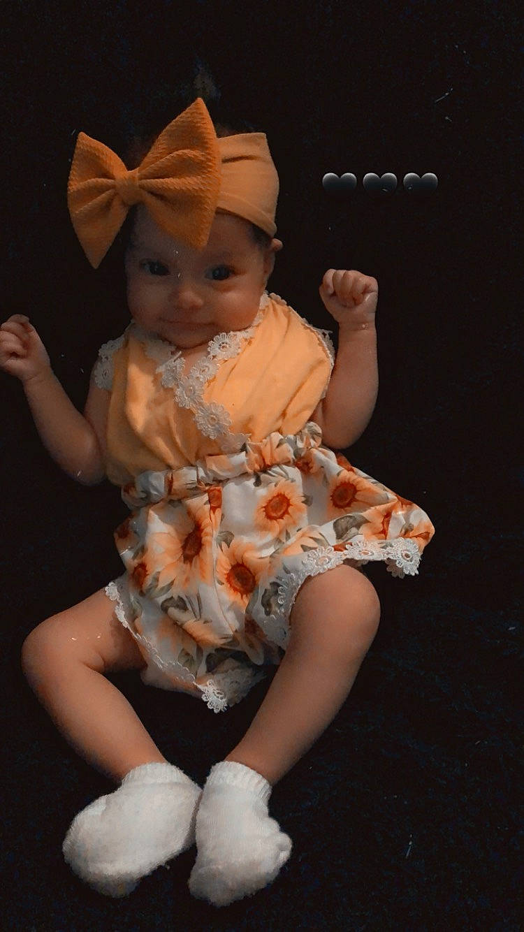 Lidia joined the competition — help win amazing prizes! baby, baby_toddler_clothing, costume, costume_hat, day_dress, dress, fashion_accessory, fawn, fun, hat, headgear, headpiece, headwear, human_leg, jewellery, peach, person, pink, sitting, sun_hat