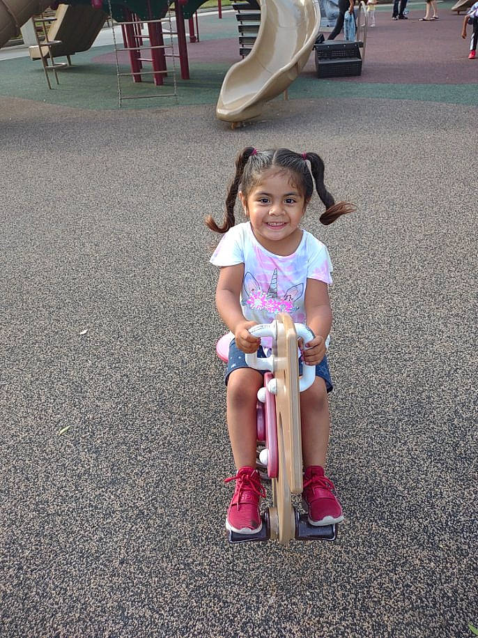 Isabel joined the competition — help win amazing prizes! asphalt, dress, fun, happy, human, joy, leg, leisure, mammal, people, person, photograph, public_space, shoe, shorts, smile, sneakers, tire, toddler, vertebrate