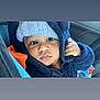 baby, child, face, hoodie, hat, knitted, cozy, blue, orange, blanket, closeup, curious, indoors, person, portrait, warm, snug, cute, young, infant