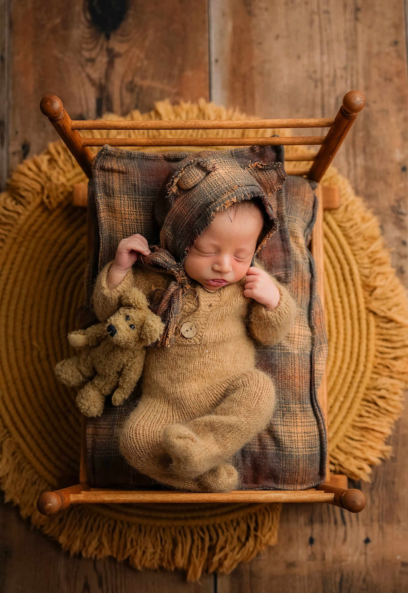 Colton is registered to the contest to win money with this photo: newborn, baby, sleeping, knitted_outfit, bear_ears, teddy_bear, miniature_bed, plaid_blanket, wooden_floor, fringed_rug, cozy, cute, infant, portrait, resting, soft_lighting, warm_tones, child, adorable, peaceful