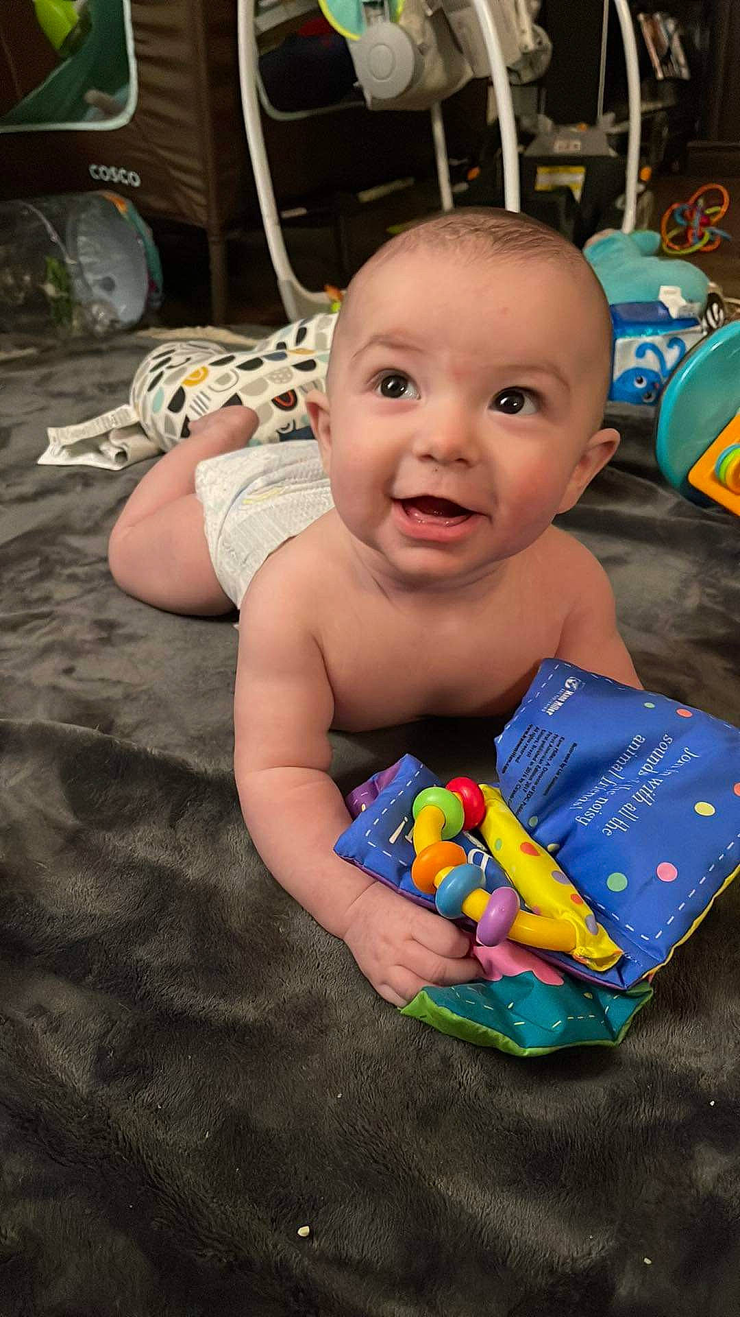 Ronald is registered to the contest to win money with this photo: baby, baby_playing_with_toys, baby_products, baby_toys, cheek, child, event, flooring, fun, happy, leisure, person, plastic, play, room, sitting, smile, sweetness, toddler, toy