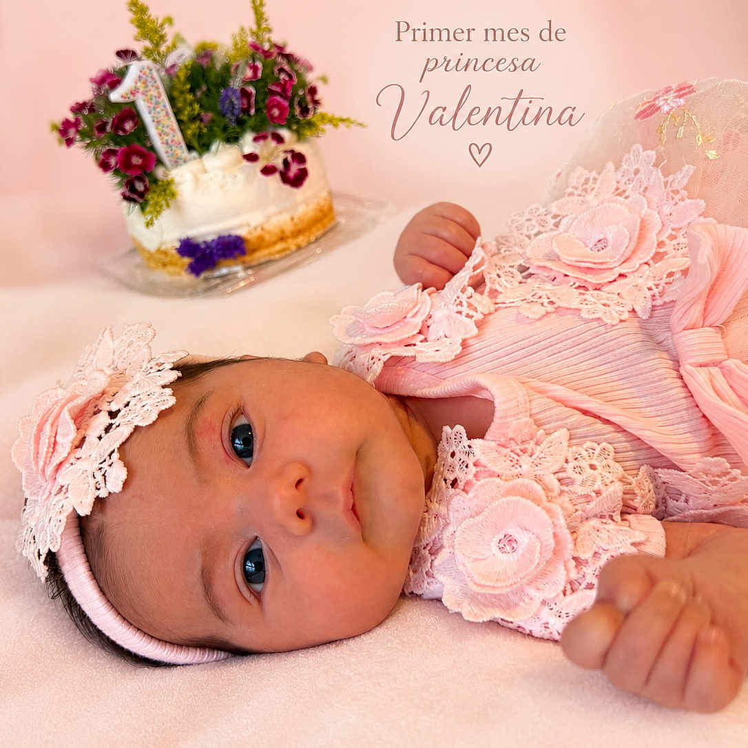 Valentina joined the competition — help win amazing prizes! baby, infant, child, portrait, lying_down, pink_dress, lace, headband, flowers, birthday_cake, celebration, cake, floral_decoration, smiling, eyes_open, indoors, soft_blanket, pastel_colors, close_up, text_overlay