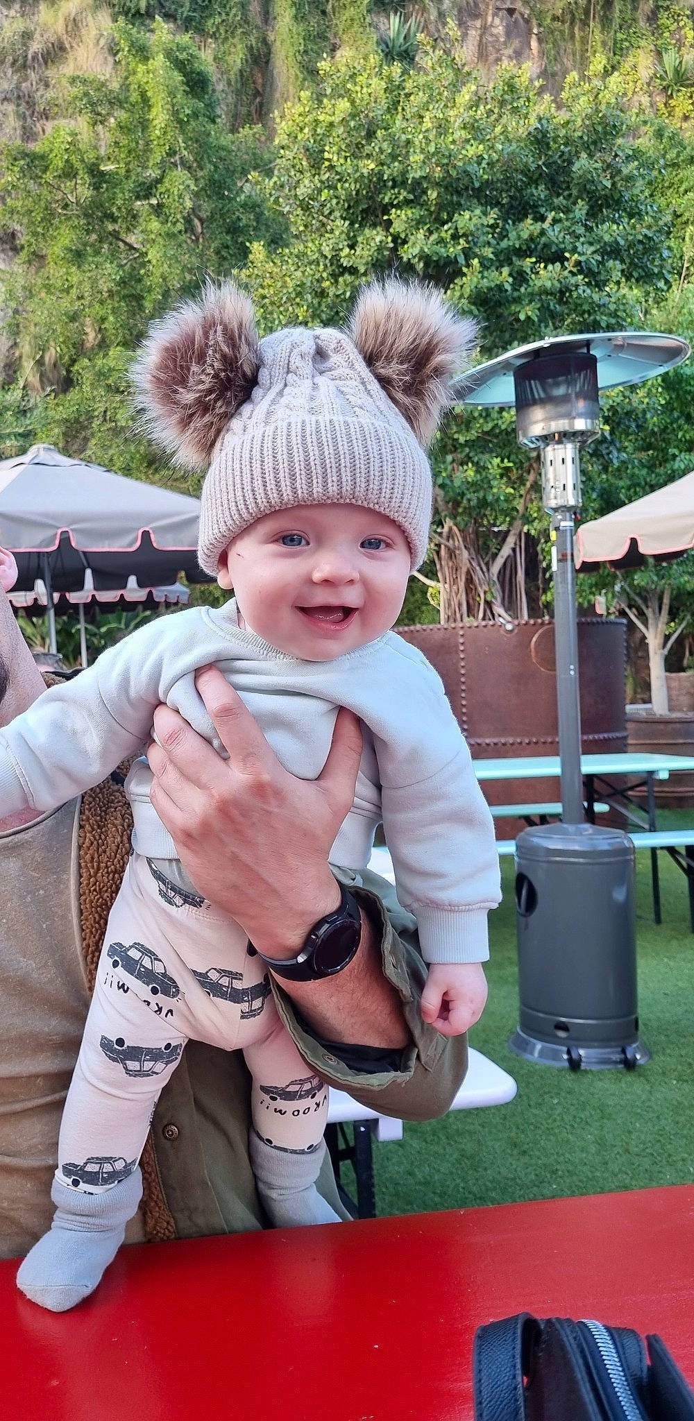 Cayden is registered to the contest to win money with this photo: baby, baby_toddler_clothing, cap, child, event, fashion_accessory, fun, grass, happy, hat, headwear, joy, leisure, person, pink, recreation, sitting, skin, smile, sun_hat