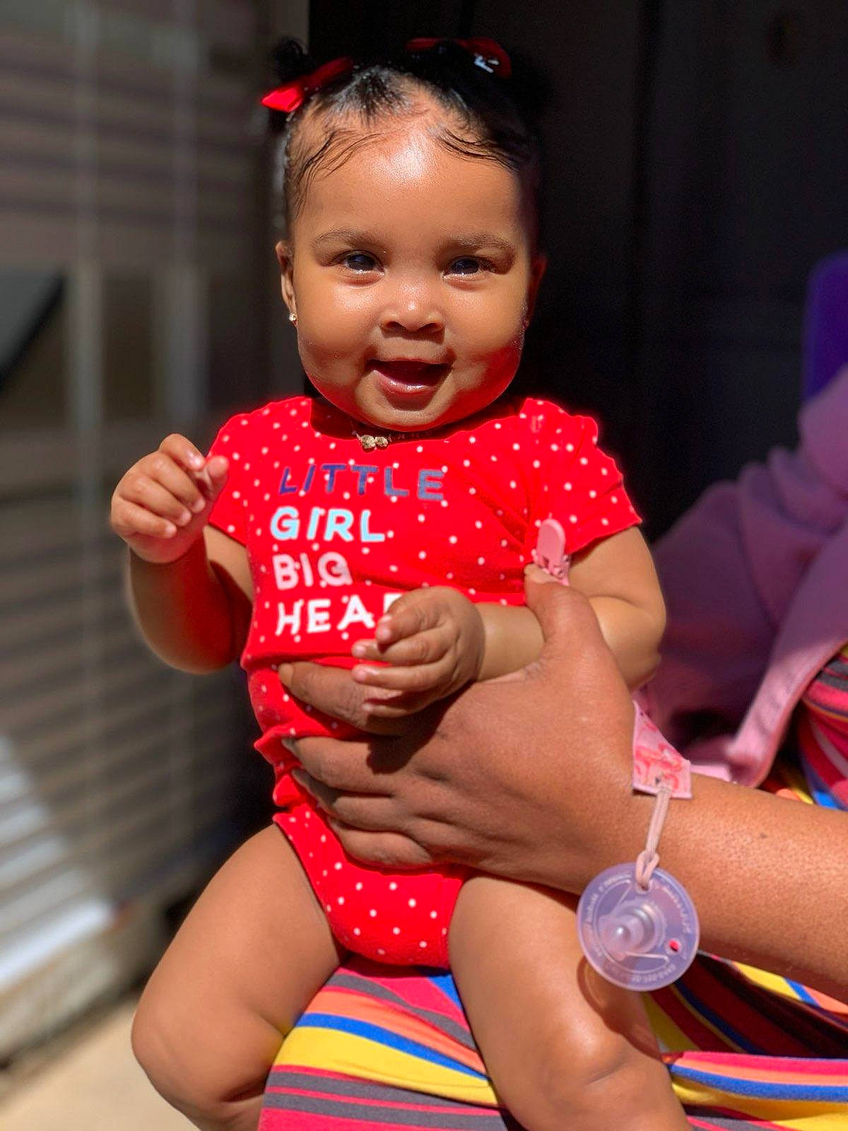 Brooklynn is registered to the contest to win money with this photo: baby, baby_toddler_clothing, dress, eye, face, hair, hand, happy, head, leg, lip, mouth, nail, person, pink, red, skin, smile, thigh, toddler