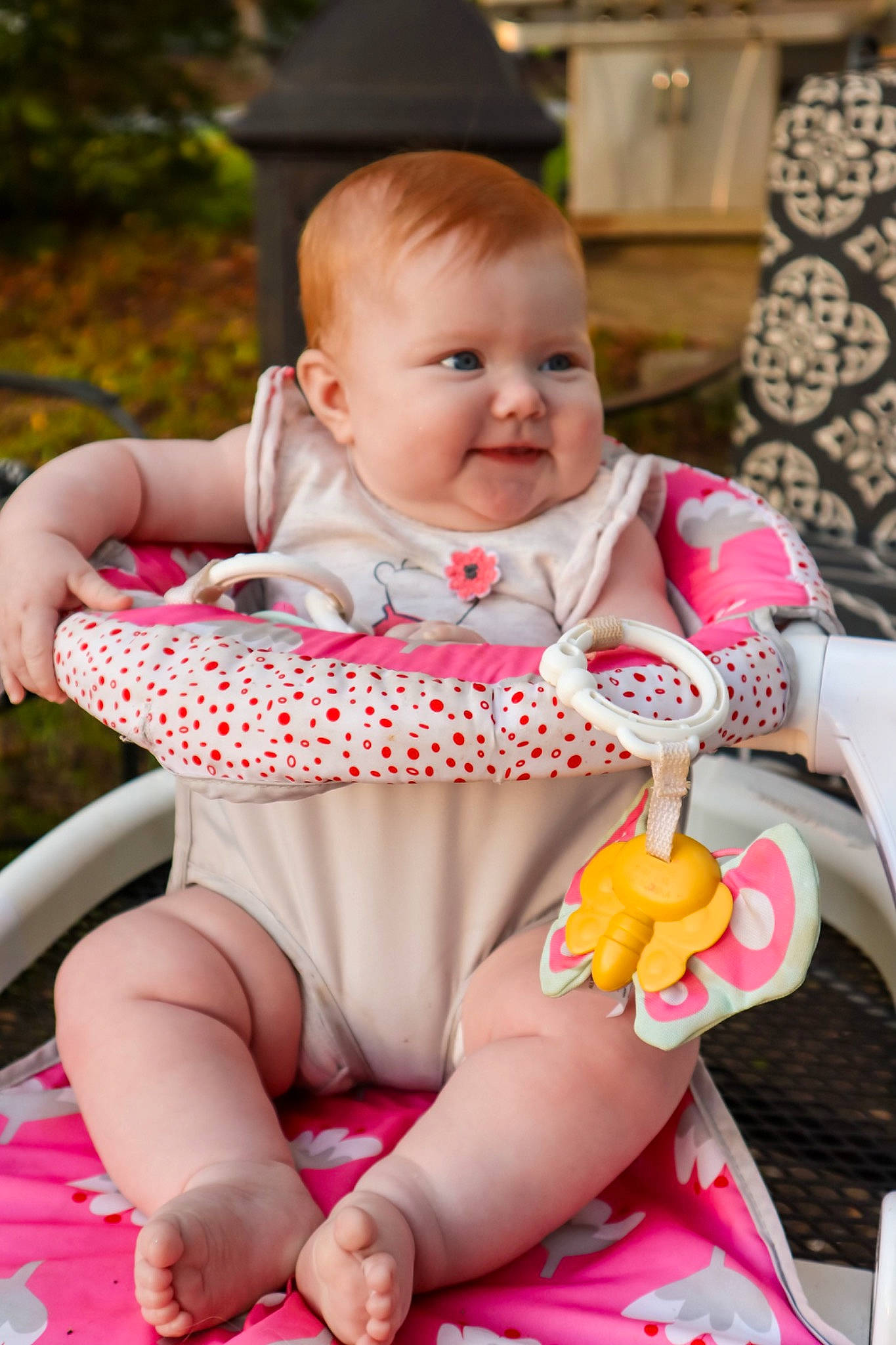 Bayleigh is registered to the contest to win money with this photo: baby, baby_toddler_clothing, chair, cheek, child, eye, face, facial_expression, finger, happy, head, orange, person, photograph, pink, product, red, skin, toddler, white