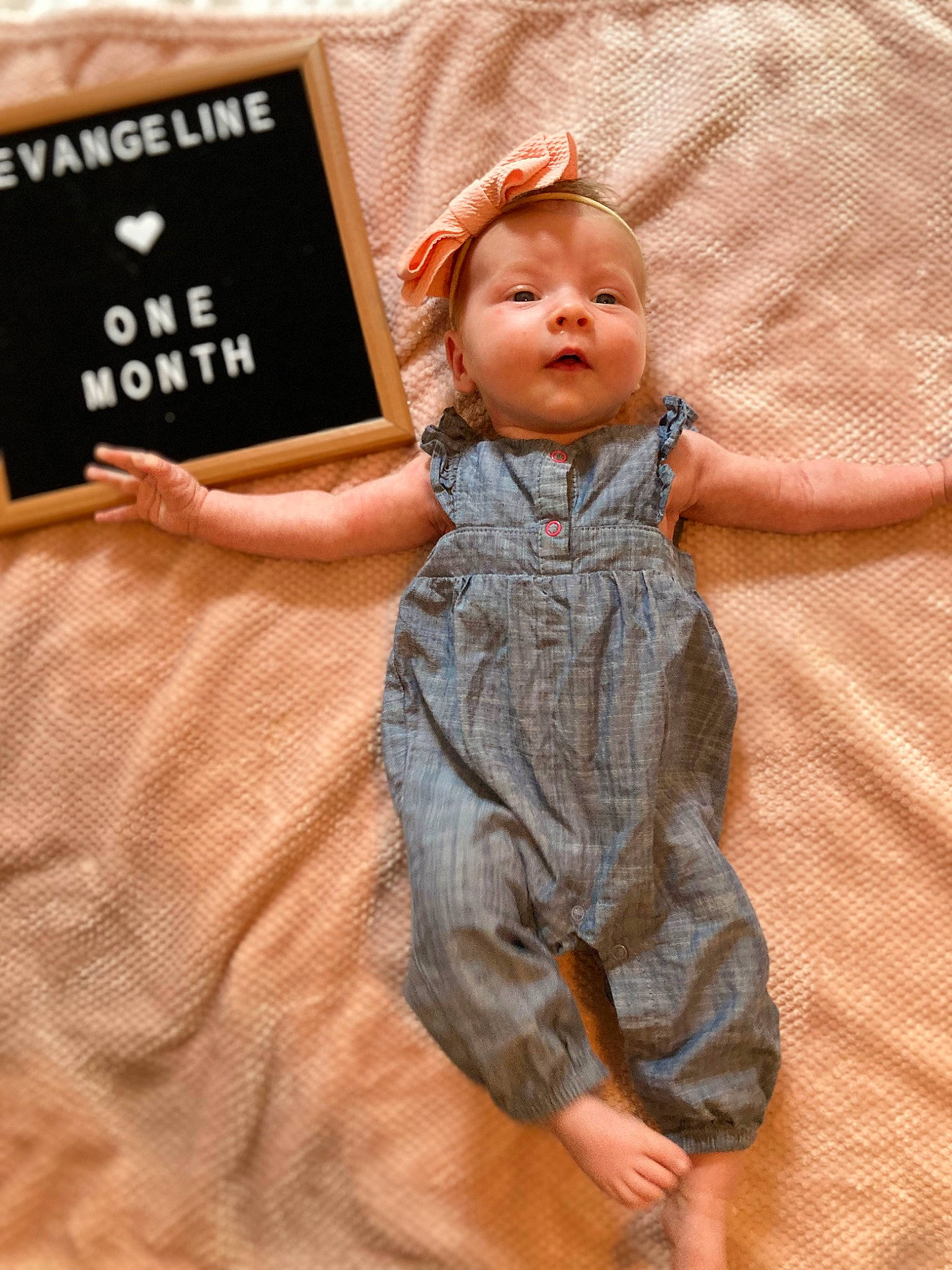 Eva is registered to the contest to win money with this photo: baby, baby_toddler_clothing, child, comfort, eye, finger, flooring, fun, fur, gesture, happy, linens, orange, peach, person, room, skin, sleeve, thumb, toddler