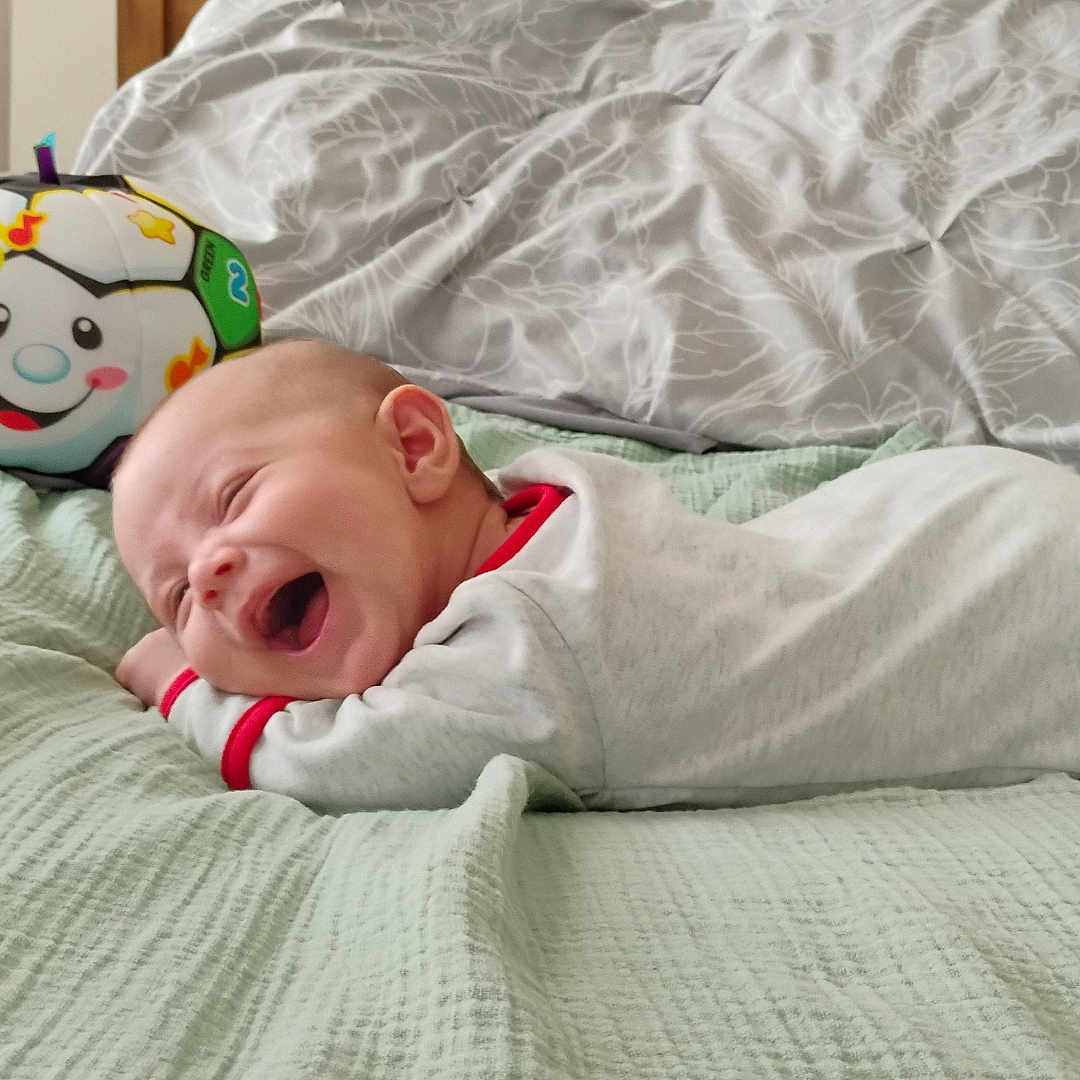 Luca joined the competition — help win amazing prizes! baby, ball, blanket, couch, cushion, face, football, furniture, happy, head, homedecor, person, photography, portrait, soccer, soccerball, sphere, sport, toy, yawning