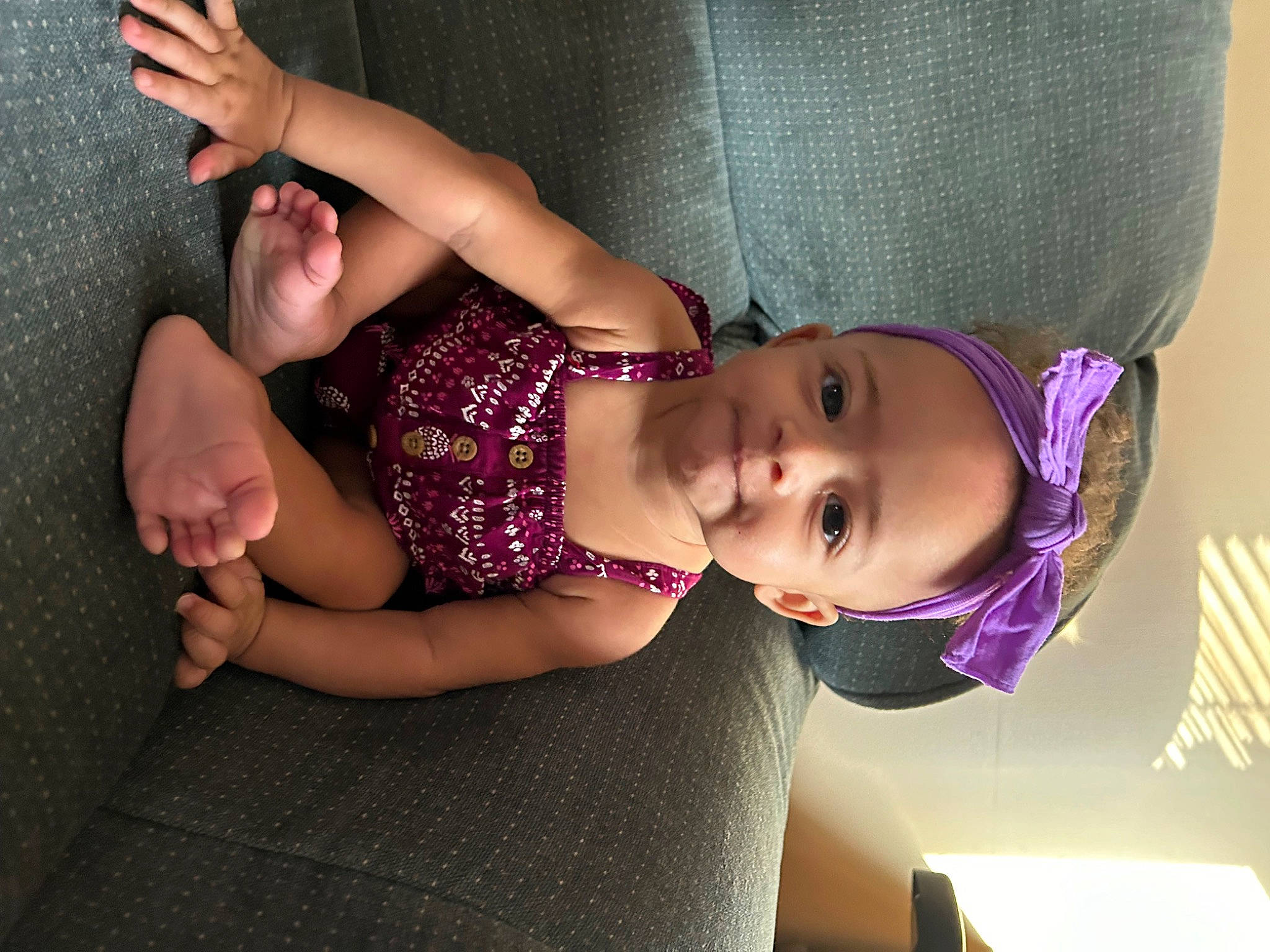 Ocean is registered to the contest to win money with this photo: arm, baby, baby_toddler_clothing, child, comfort, elbow, eye, eyelash, finger, flash_photography, hand, human_leg, joy, knee, person, pink, purple, shoulder, skin, thigh