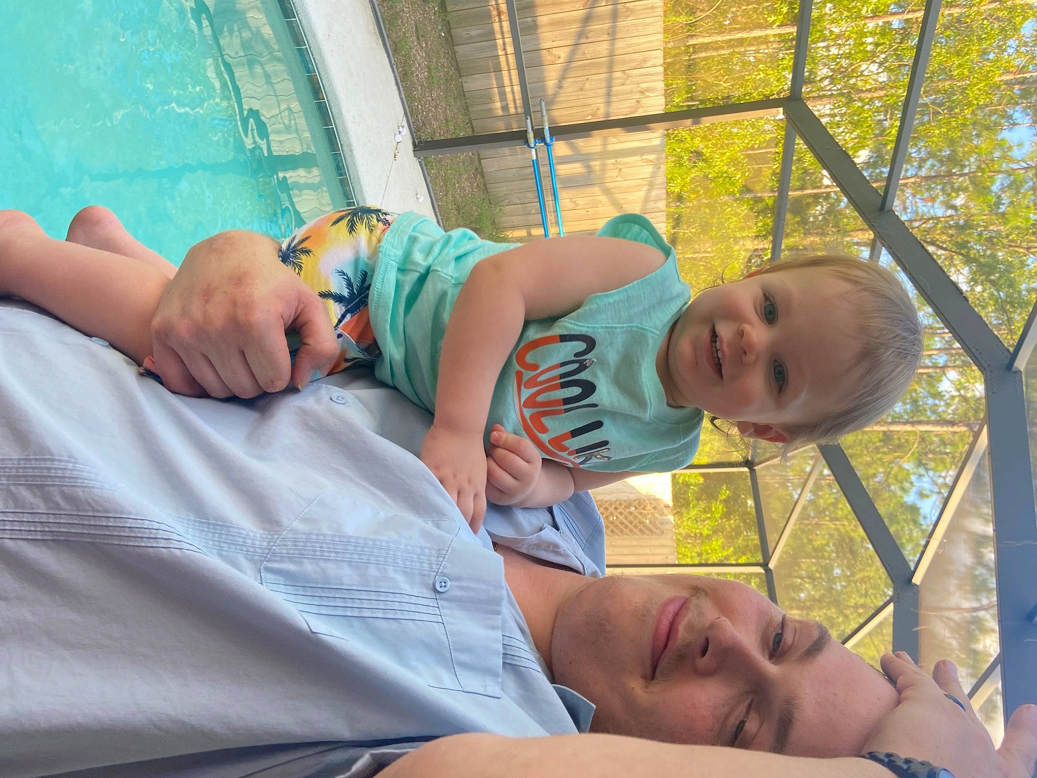 Philip is registered to the contest to win money with this photo: baby, baby_toddler_clothing, child, comfort, face, facial_expression, fun, grass, happy, head, human, joy, leaf, leisure, mammal, morning, muscle, person, smile, toddler