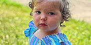 Avery joined the competition — help win amazing prizes! blurred_background, car, child, curly_hair, cute, daylight, dress, grass, nature, outdoor, person, pony_tail, portrait, serious_expression, sitting, skin, striped_clothing, summer, toddler, young_child