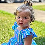 child, toddler, curly_hair, pony_tail, dress, striped_clothing, grass, outdoor, daylight, serious_expression, person, young_child, sitting, nature, car, blurred_background, portrait, summer, cute, skin