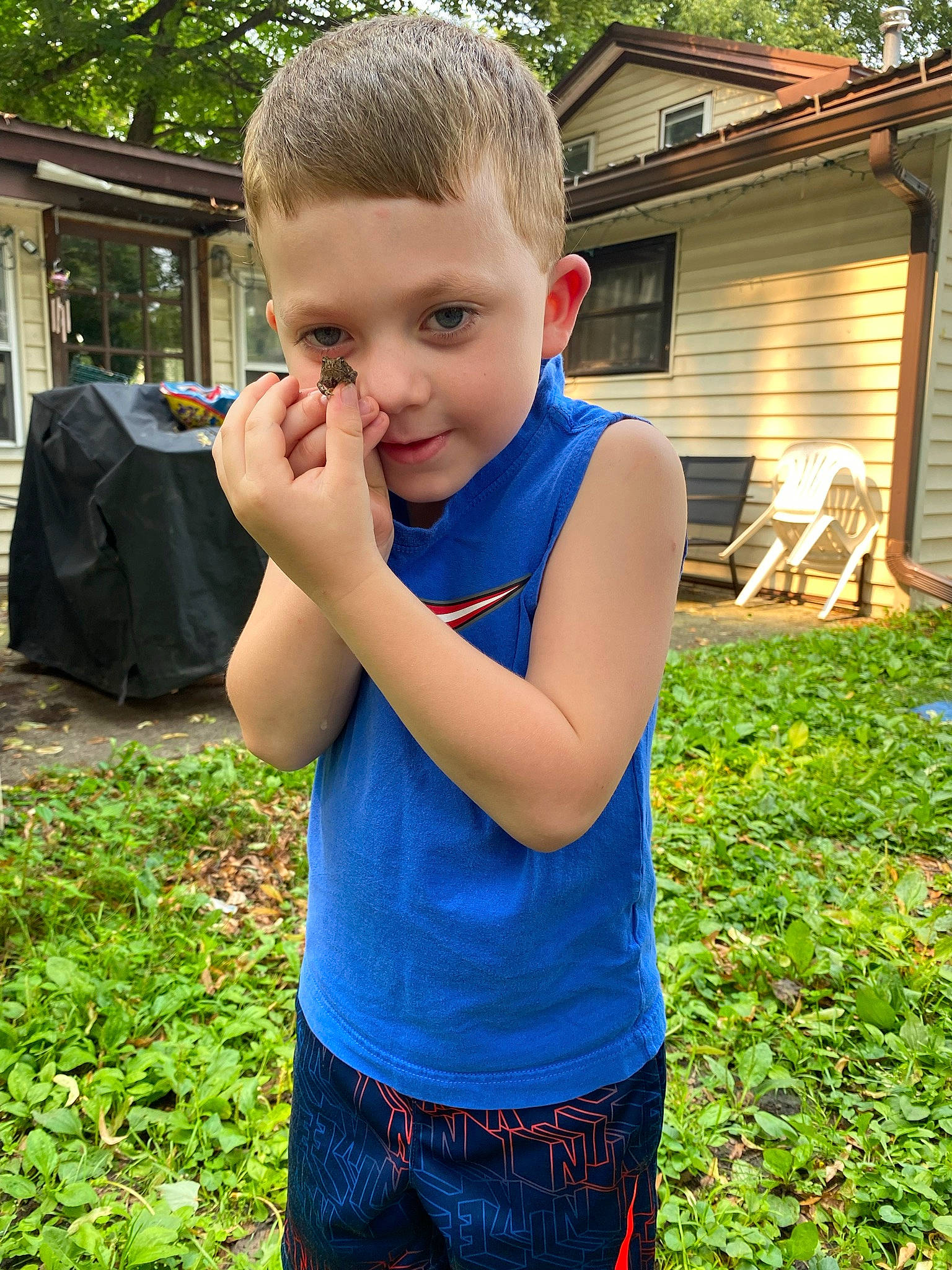 Deegan joined the competition — help win amazing prizes! child, electric_blue, finger, fun, garden, gesture, grass, hair, hand, happy, head, house, lawn, leisure, people_in_nature, person, plant, shoulder, t_shirt, toddler