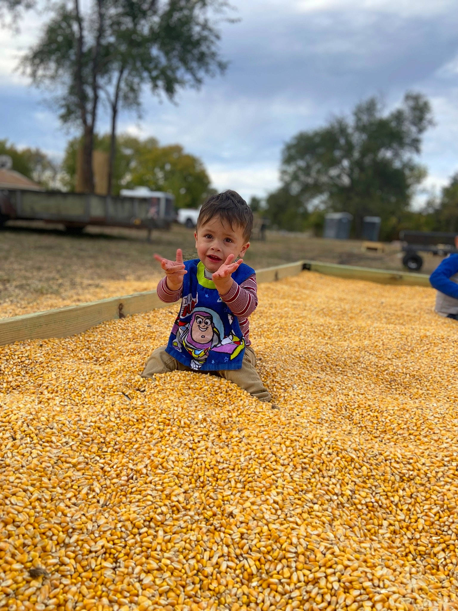 Kaiser is registered to the contest to win money with this photo: baby, child, city, cloud, deciduous, flooring, fun, grass, happy, landscape, leisure, people_in_nature, person, public_space, recreation, sand, sky, smile, soil, toddler