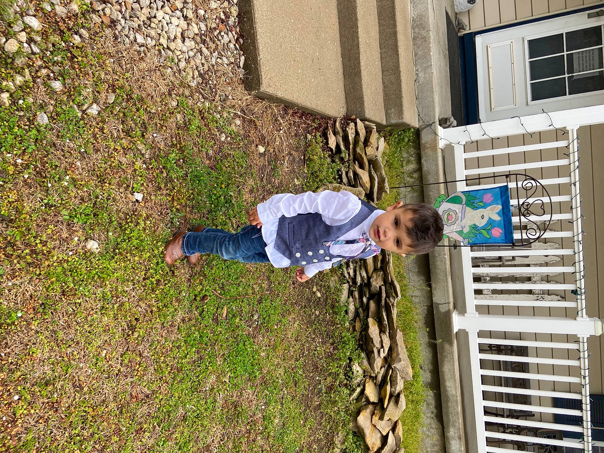 Dominik is registered to the contest to win money with this photo: building, grass, groundcover, people_in_nature, person, plant, toddler, window