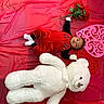 Michael joined the competition — help win amazing prizes! baby, teddy_bear, red_clothing, roses, heart_shape, lying_down, soft_toy, child, cute, indoor, decor, black_sleeves, white_socks, portrait, small_child, valentine_theme, plush_toy, baby_boy, holding_flowers, floor