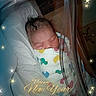 Cataleya is registered to the contest to win money with this photo: newborn, baby, sleeping, infant, portrait, blanket, swaddle, crib, nursery, indoor, festive, new_year, stars, sparkles, text_overlay, happy_new_year, peaceful, face, closed_eyes, colorful