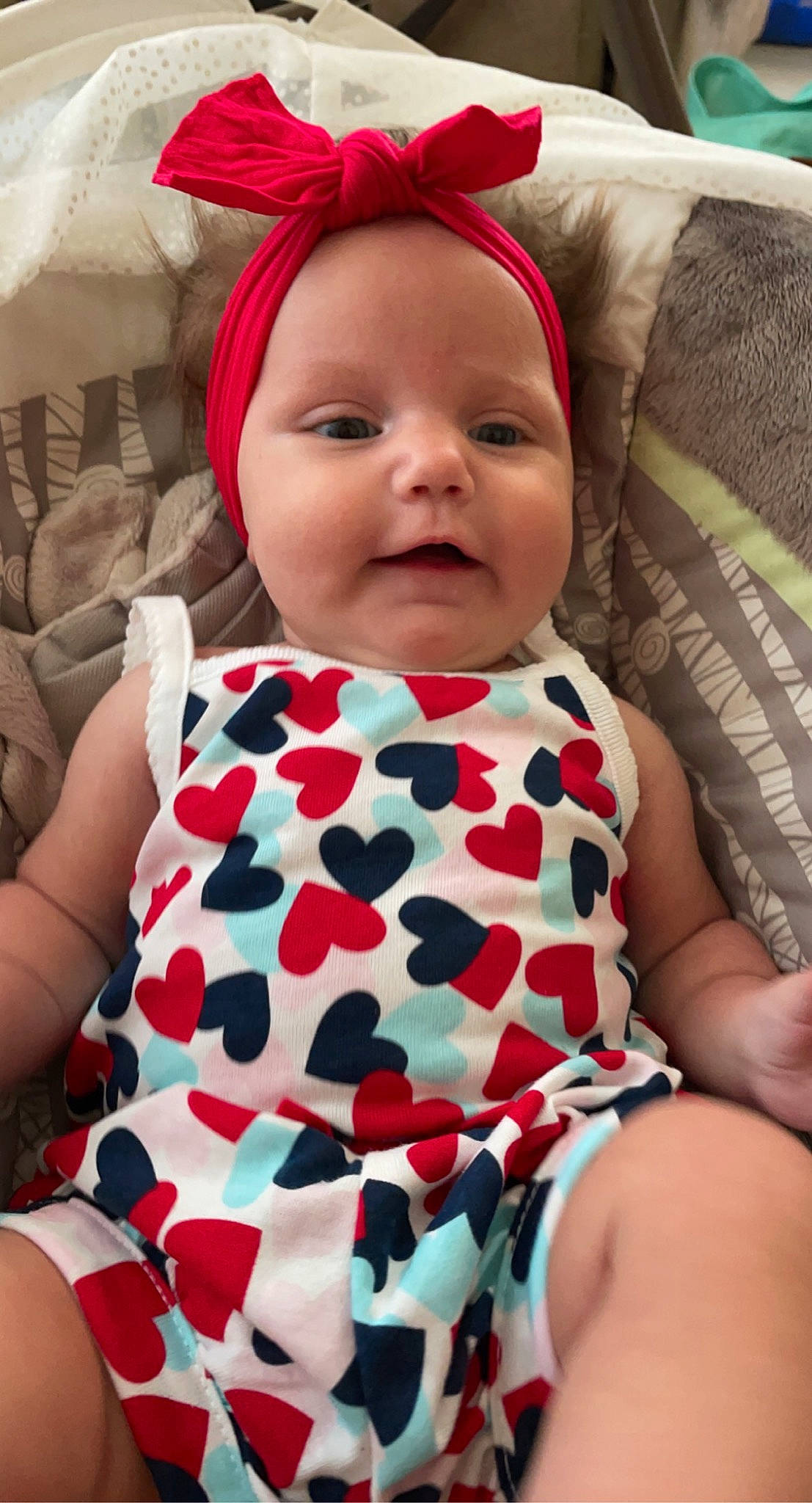 Jupiter is registered to the contest to win money with this photo: arm, baby_toddler_clothing, dress, eye, facial_expression, fashion, hairstyle, head, headwear, human, human_body, lip, mammal, neck, organ, outerwear, person, skin, sleeve, smile