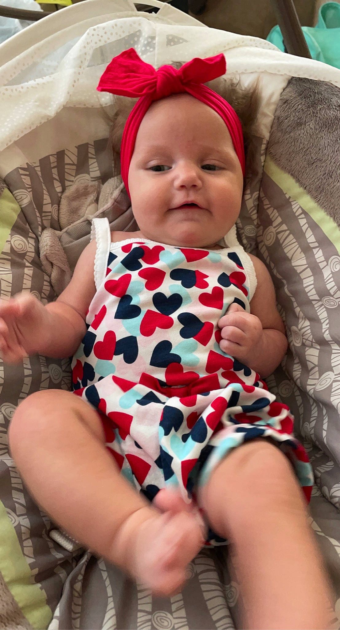 Jupiter is registered to the contest to win money with this photo: baby, baby_toddler_clothing, beauty, child, comfort, dress, eye, facial_expression, finger, happy, head, headwear, human, lip, pattern, person, pink, skin, sleeve, textile