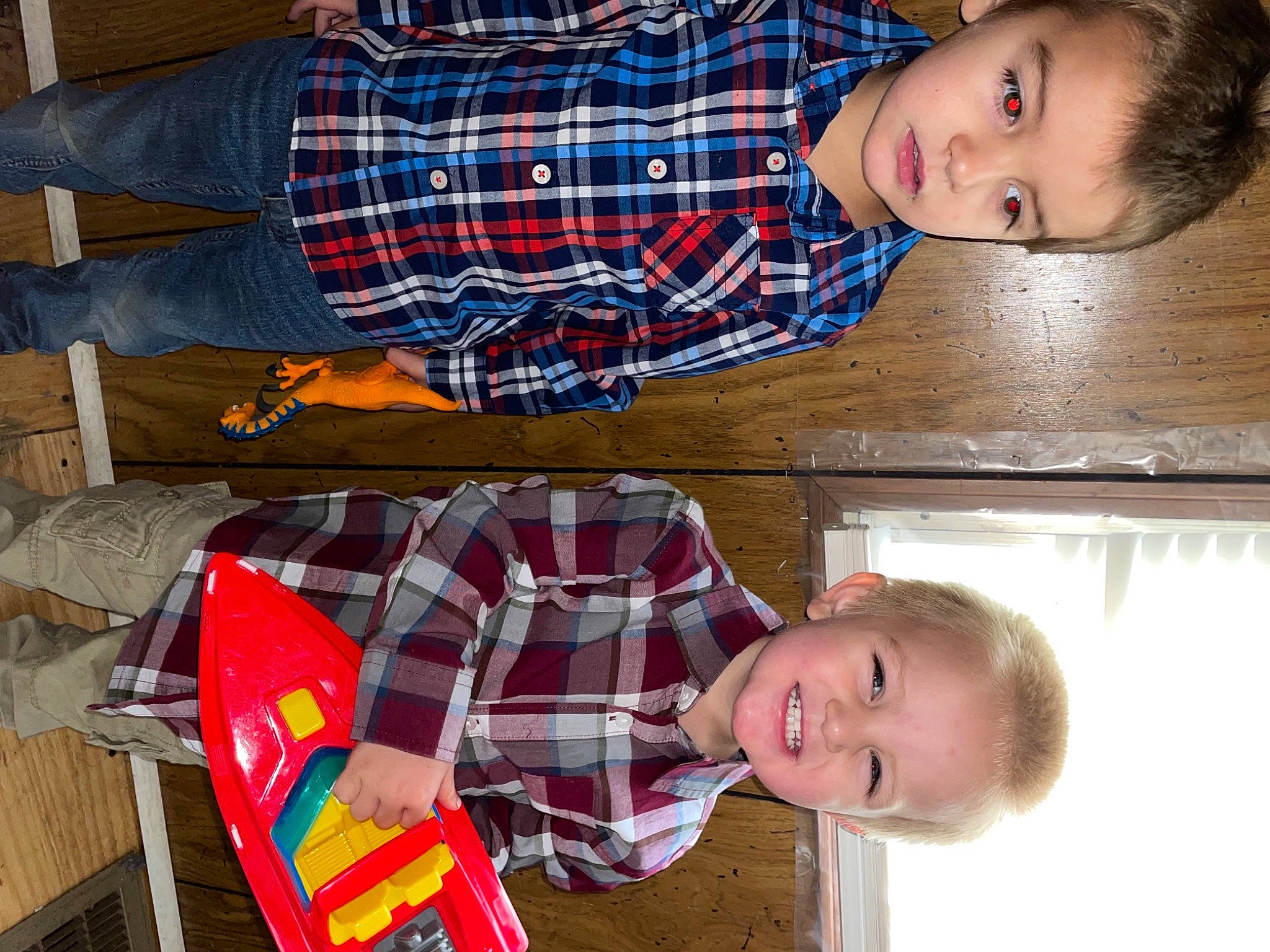 Bryson is registered to the contest to win money with this photo: child, clothing, design, fun, hair, happy, head, holiday, joy, lap, organ, pattern, person, photograph, plaid, red, smile, snapshot, tartan, textile