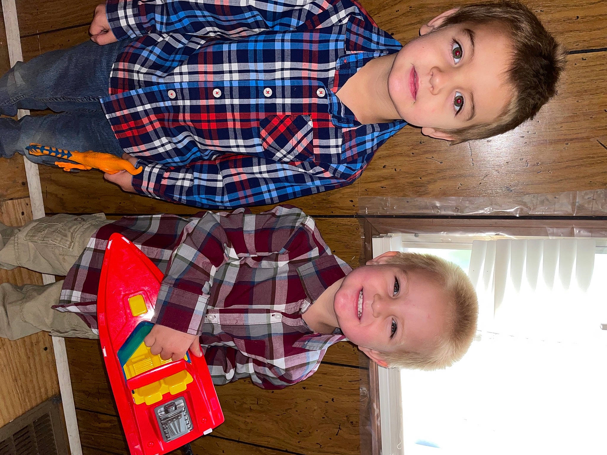 Bryson is registered to the contest to win money with this photo: blue, child, design, eye, flash_photography, fun, happy, head, holiday, joy, lap, pattern, people, person, photograph, plaid, red, sleeve, smile, tartan