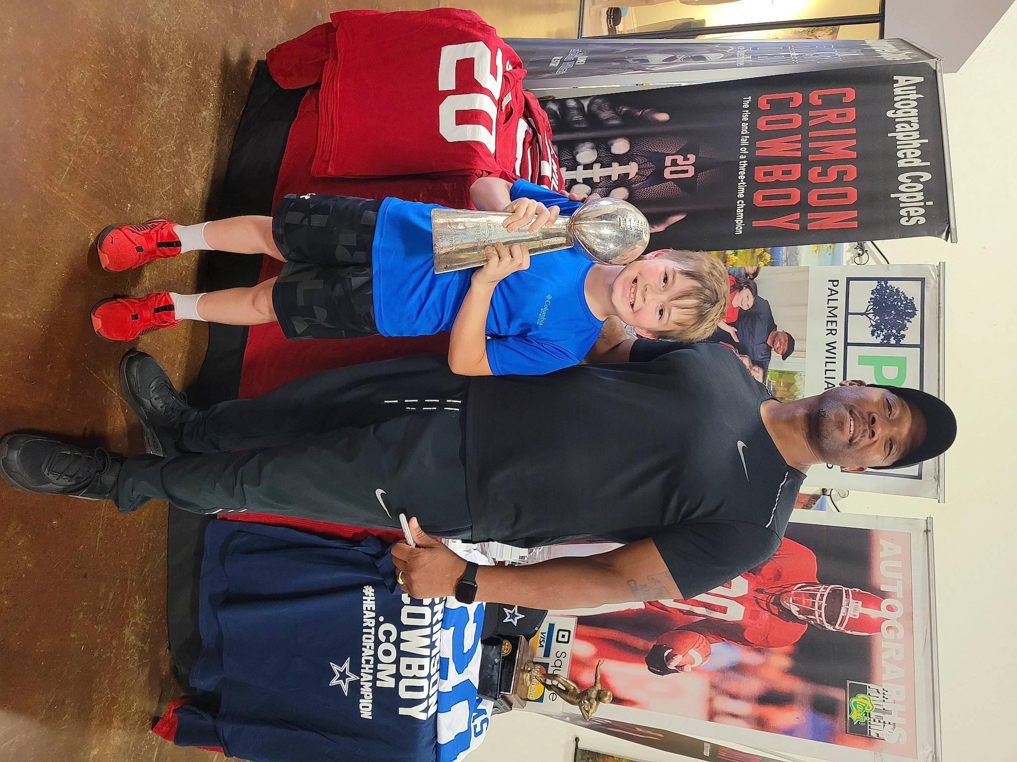 Skylar is registered to the contest to win money with this photo: advertising, arm, art, carmine, elbow, headwear, human_leg, joy, knee, person, shorts, smile, sportswear, t_shirt, wrist