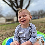 Maverick joined the competition — help win amazing prizes! baby, babylaughing, backyard, clothing, crying, face, grass, happy, head, laughing, outdoors, pants, person, photography, plant, portrait, sad, sitting, smile, tree