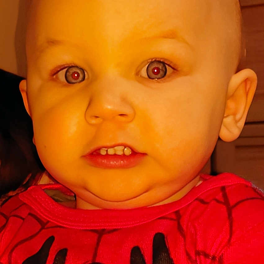 Christian is registered to the contest to win money with this photo: applique, baby, bodypart, clothing, face, finger, hand, happy, head, knitwear, mouth, newborn, pattern, person, photography, portrait, smile, sweater, sweatshirt, t_shirt