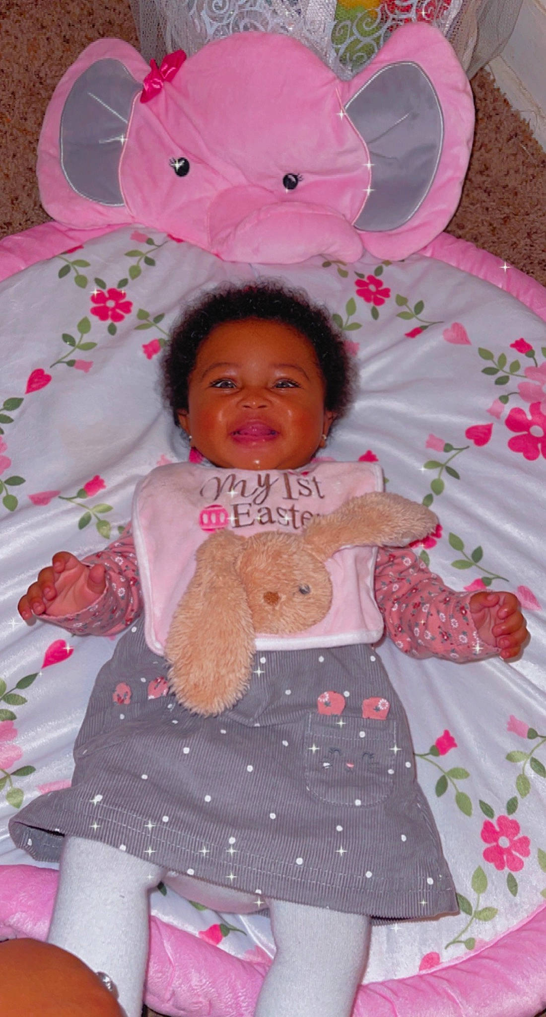 Aryiah is registered to the contest to win money with this photo: baby, baby_toddler_clothing, cheek, child, circle, design, fun, happy, linens, magenta, pattern, person, petal, pink, product, skin, sleeve, smile, textile, toddler