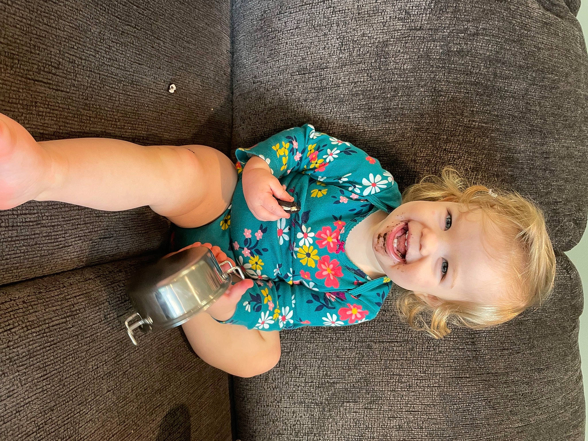 Alayna is registered to the contest to win money with this photo: arm, baby_toddler_clothing, child, cool, elbow, electric_blue, finger, hand, happy, human_leg, joint, joy, leg, pattern, person, sleeve, smile, textile, thigh, toddler