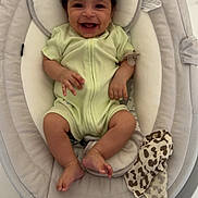 Naël a rejoint le concours — aidez-le/la à gagner de superbes lots ! baby, smiling, infant, onesie, baby_rocker, soft_toy, floor, headrest, comfortable, happy, child, indoor, baby_clothing, baby_accessory, relaxing, cute, human, small_child, playtime, tiled_floor