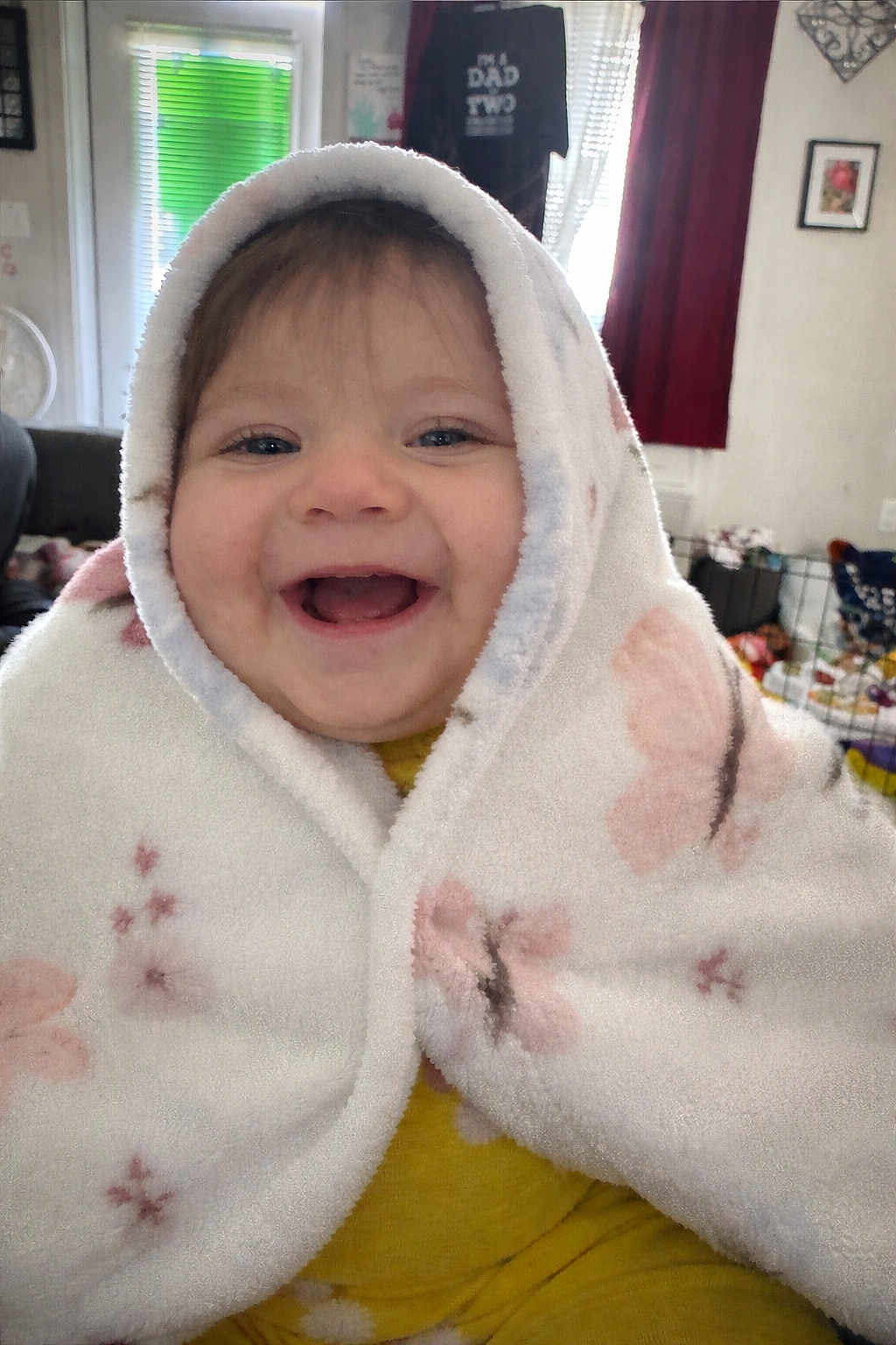 Ruby-Ann is registered to the contest to win money with this photo: baby, child, smiling, blanket, indoor, portrait, happy, face, cozy, yellow_clothing, toddler, cute, wrapped, childhood, expression, home, soft_texture, infant, person, warm