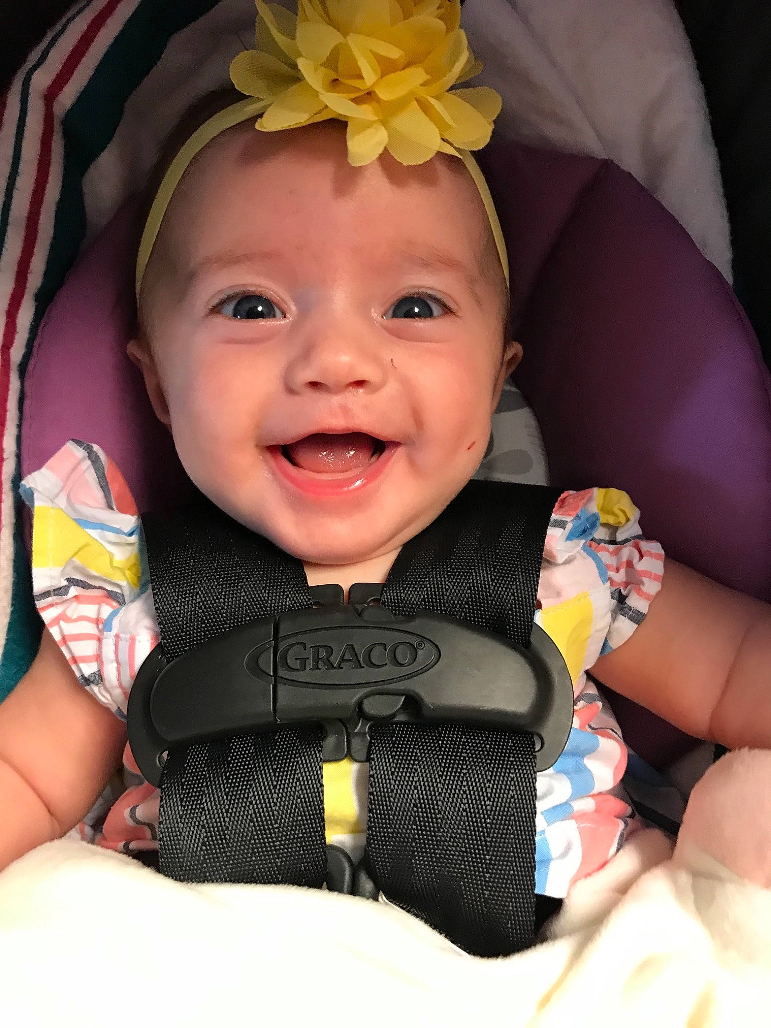 Reagan is registered to the contest to win money with this photo: baby, baby_carriage, baby_in_car_seat, baby_products, car_seat, cheek, child, chin, facial_expression, forehead, fun, head, headgear, iris, mouth, person, product, skin, smile, toddler