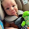Kayson joined the competition — help win amazing prizes! baby, infant, car_seat, child, plush_toy, harness, close_up, cute, seatbelt, child_safety, soft_lighting, car_accessory, infant_clothing, green_toy, face, person, baby_boy, expression, indoors, comfort