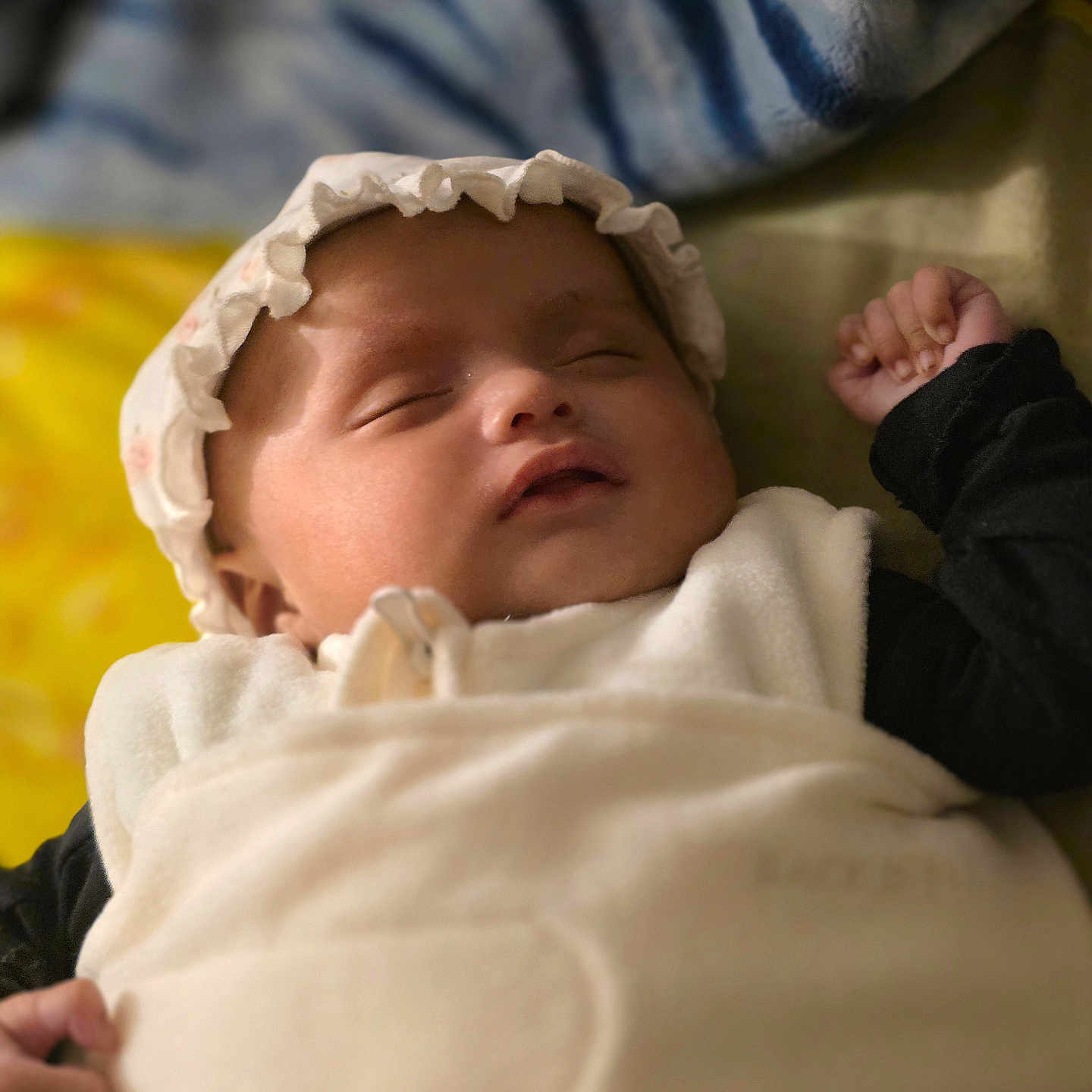 Afiya joined the competition — help win amazing prizes! baby, blanket, cap, child, closeup, cozy, cute, face, hands, indoor, infant, peaceful, portrait, relaxed, resting, sleeping, soft_texture, warm, white_clothing, young