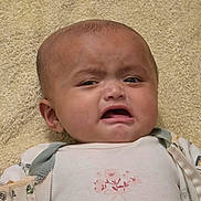 Afiya joined the competition — help win amazing prizes! adorable, baby, babywear, close_up, clothing, crying, ear, expression, eyebrows, eyes, face, head, indoor, infant, mouth, onesie, portrait, skin, towel, upset