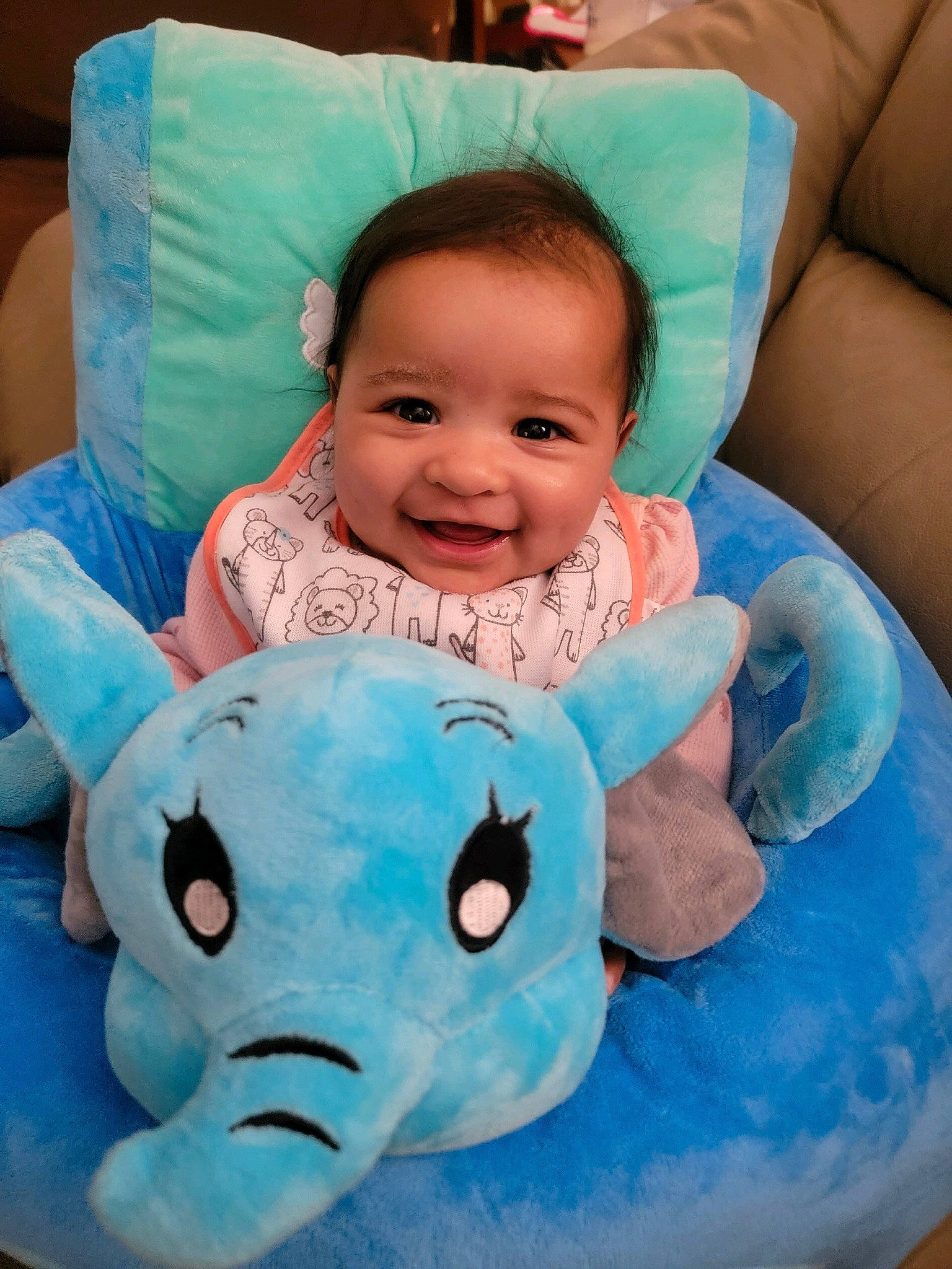 Cleo is registered to the contest to win money with this photo: aqua, azure, baby_toddler_clothing, comfort, face, facial_expression, finger, green, happy, head, joy, mammal, organ, person, photograph, pink, product, skin, smile, textile