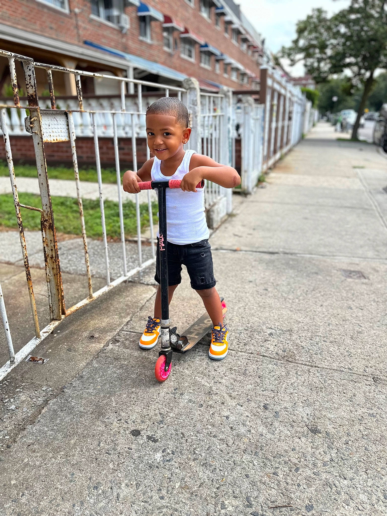 Asher joined the competition — help win amazing prizes! asphalt, ball, building, electric_blue, house, knee, leg, leisure, person, plant, recreation, road, road_surface, running, shorts, sidewalk, sky, sports, t_shirt, toddler
