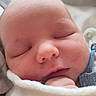 Wyatt is registered to the contest to win money with this photo: baby, newborn, sleeping, face, blanket, pacifier, hand, skin, infant, closeup, peaceful, cozy, cute, child, portrait, indoors, soft, resting, human, wrapped