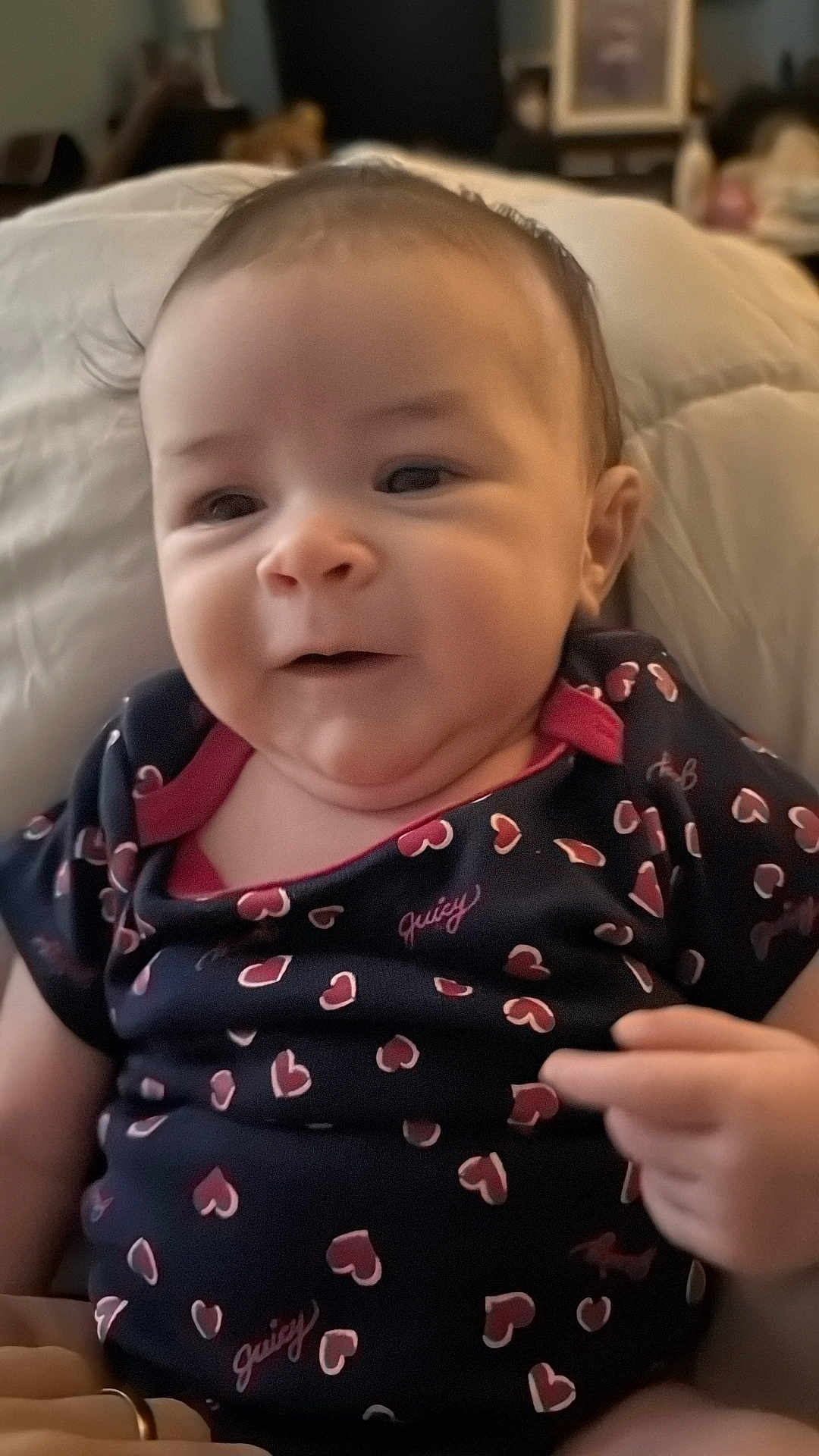 Jupiter joined the competition — help win amazing prizes! baby, infant, child, face, smile, clothing, heart_pattern, cushion, indoor, person, cute, relaxing, skin, head, eyes, mouth, hand, soft, comfort, home